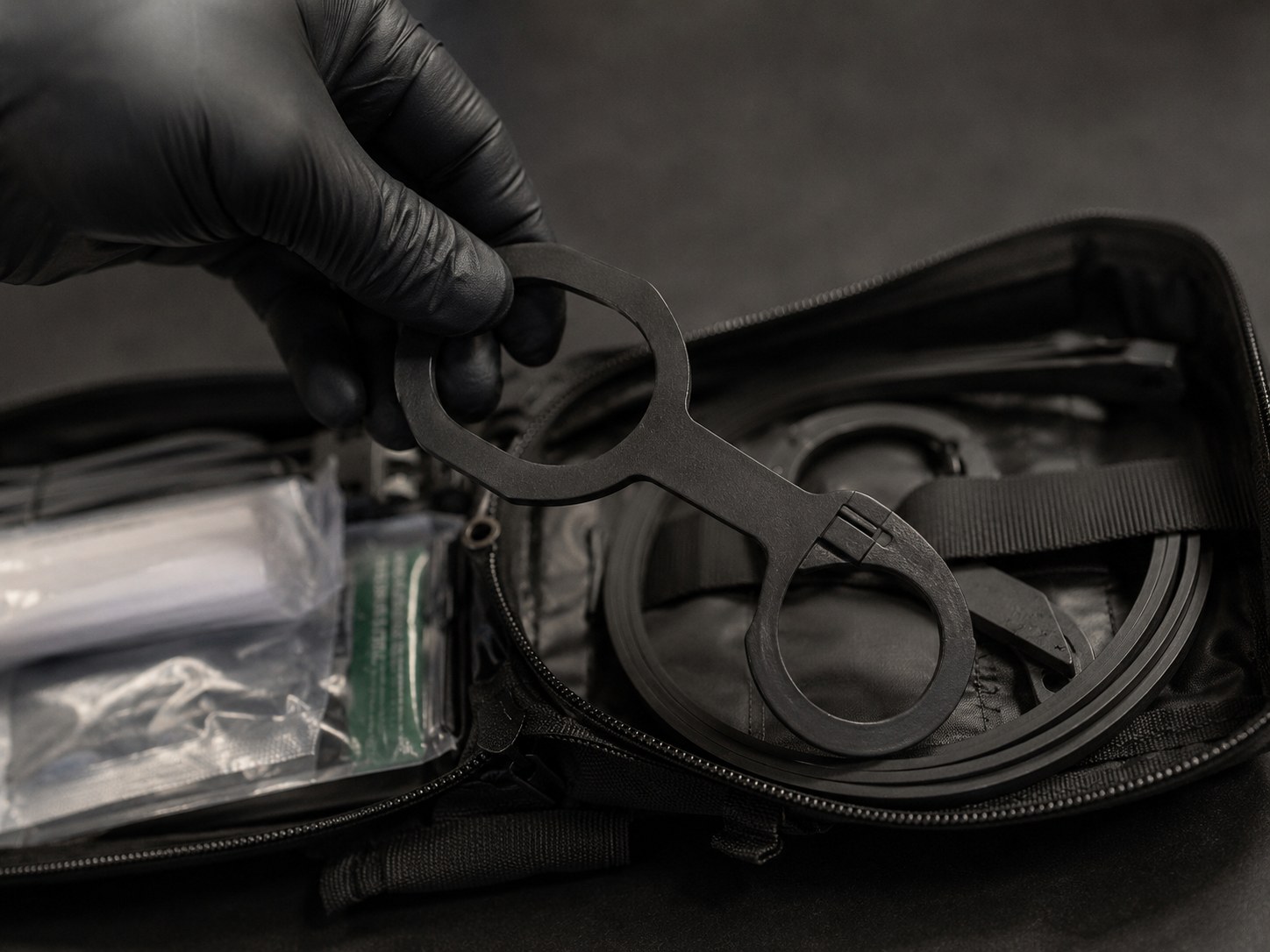 Pulling a disposable restraint from the R3 Kit - one grab, gloves already on