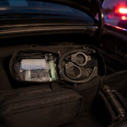 Rapid Restraint Response Kit staged open in the patrol trunk - spare restraints ready before the call
