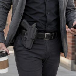 Safariland 6378 ALS paddle holster concealed under an open jacket on a plainclothes belt