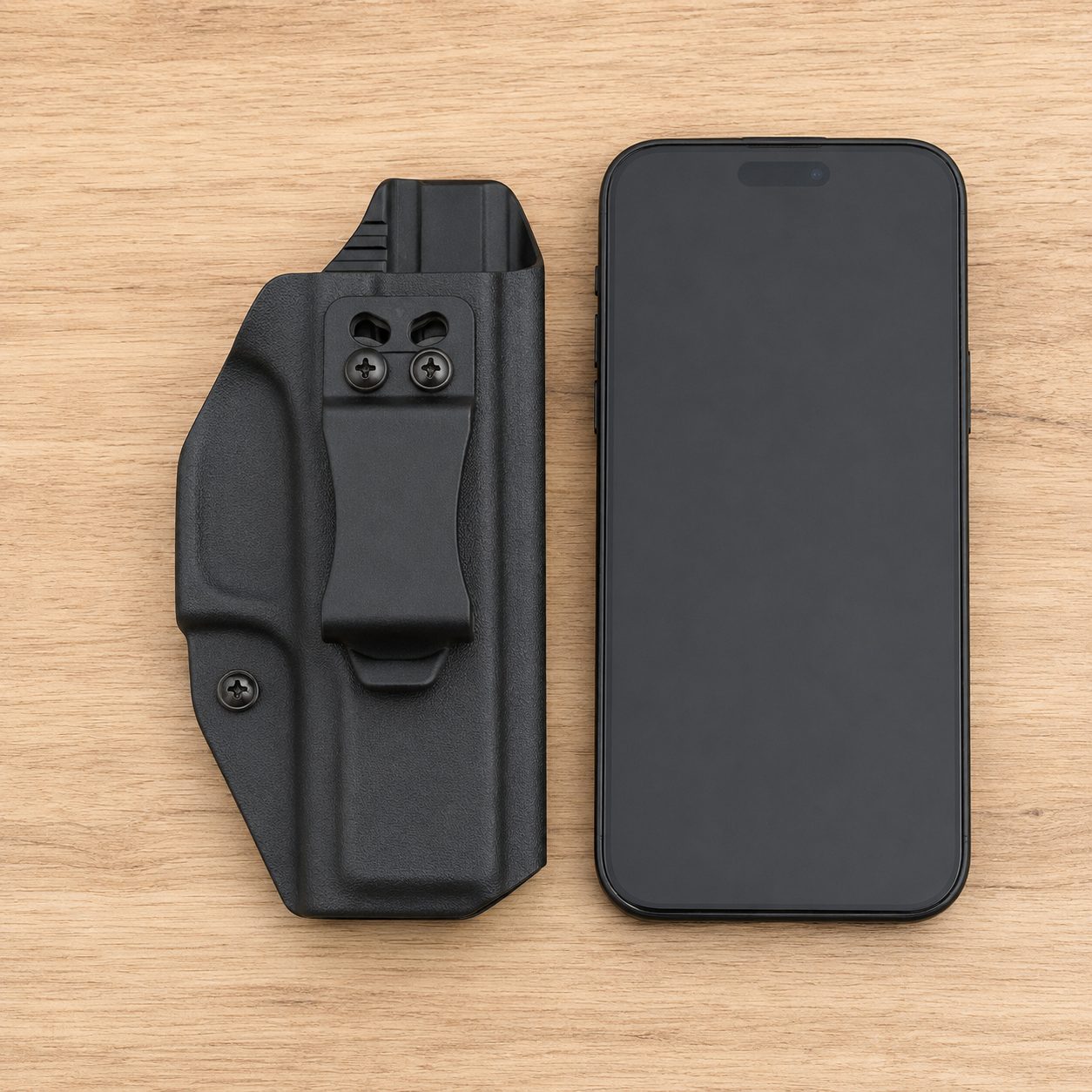 How flat the We The People Glock 43/43X Kydex shell is, next to a phone for scale